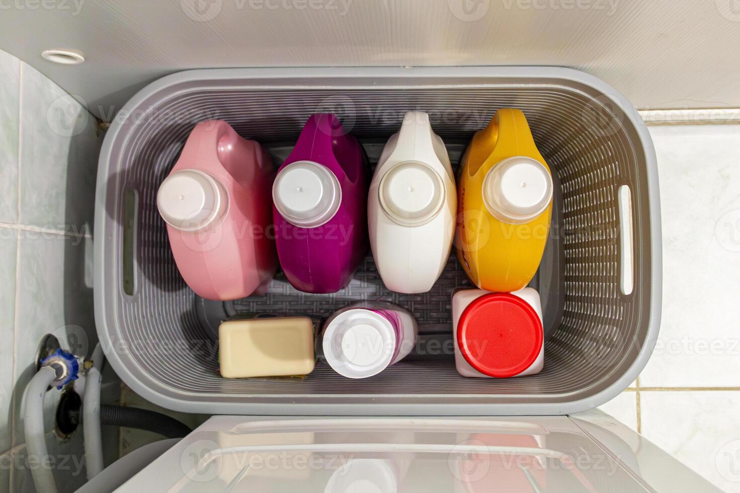 A basket filled with different colored containers photo