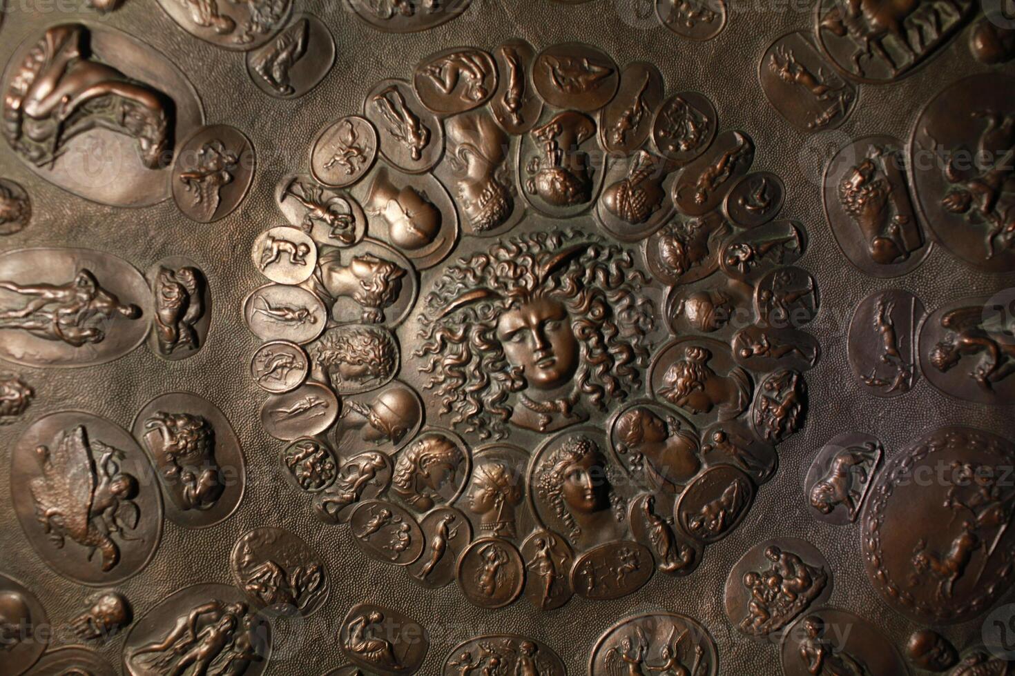 bronze aegis with the gorgon Medusa in the center and Greek mythological gods photo