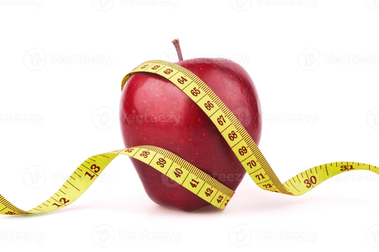 Red apple with yellow measuring tape photo