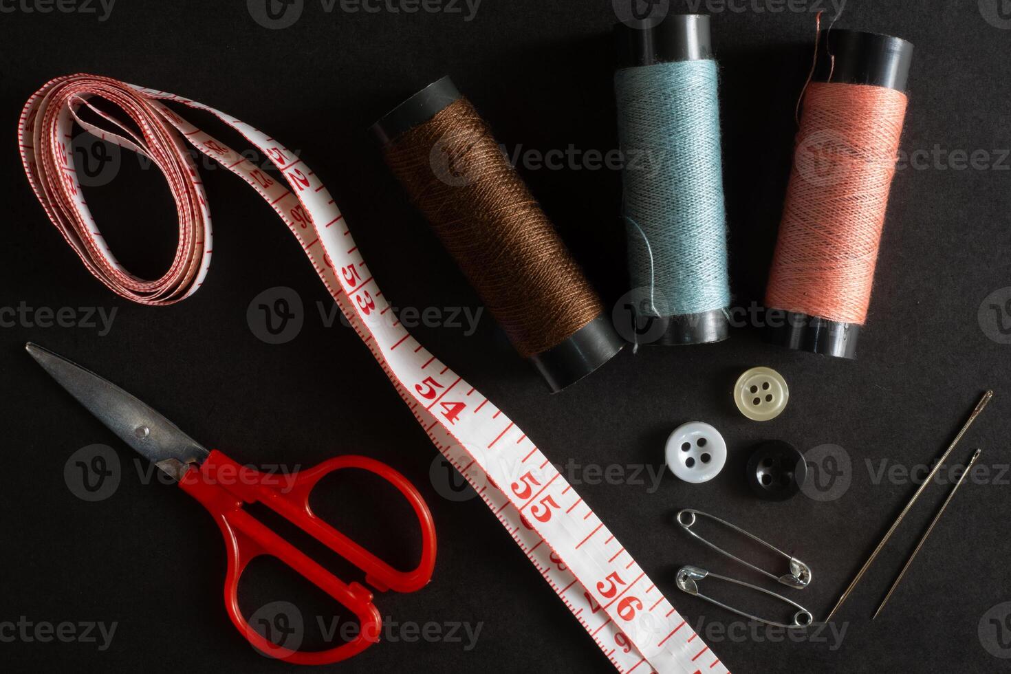 sewing tools convection flat lay on black background photo
