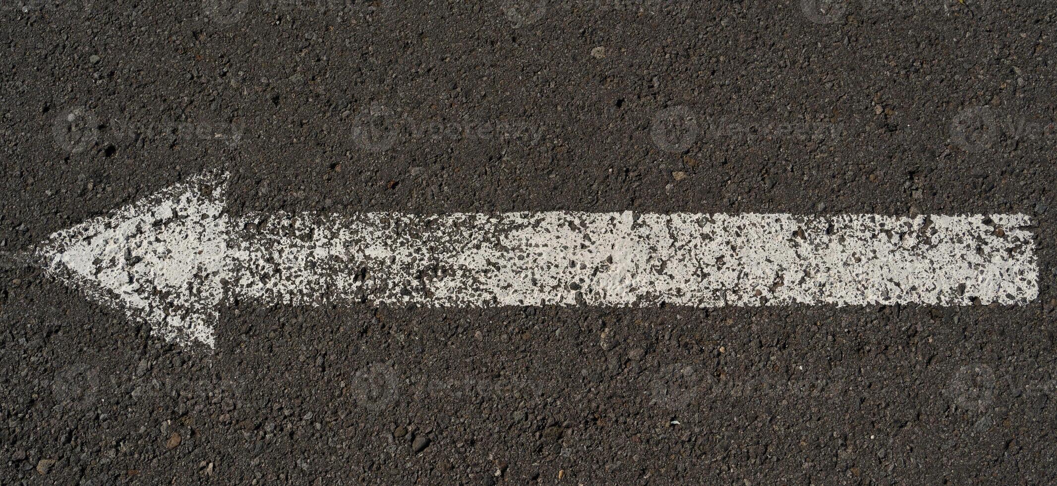 asphalt with arrow sign background photo