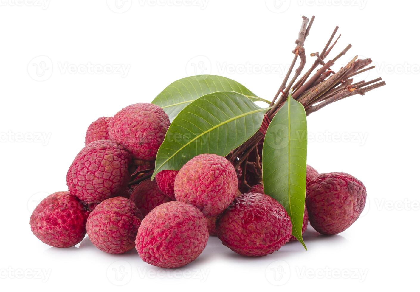 The lychees are red in bunches with green leaves. isolated on a white background photo