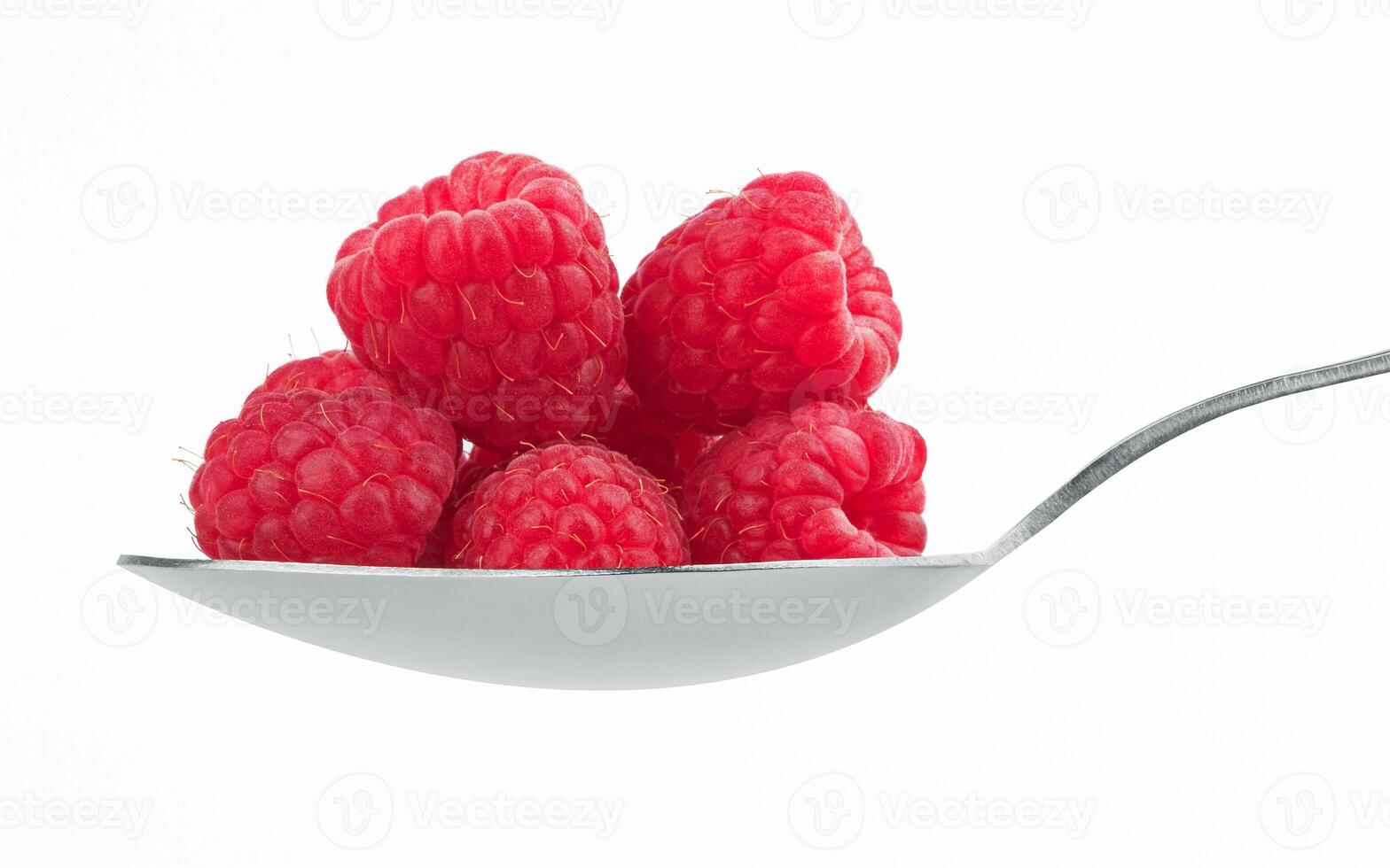 ripe red raspberry in spoon photo