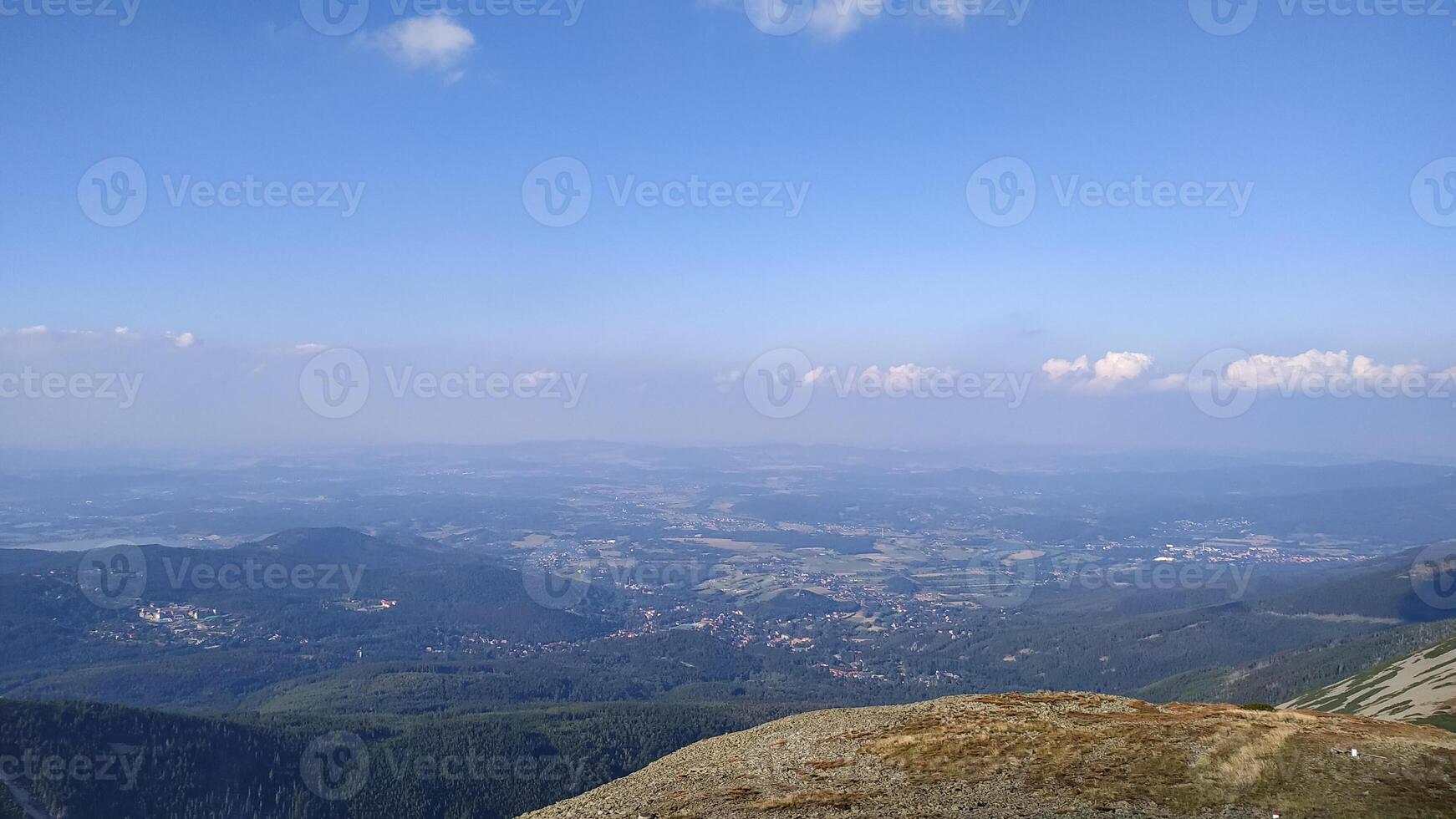 Panoramic view of krkonose mountains from snezka peak in czechia in august photo