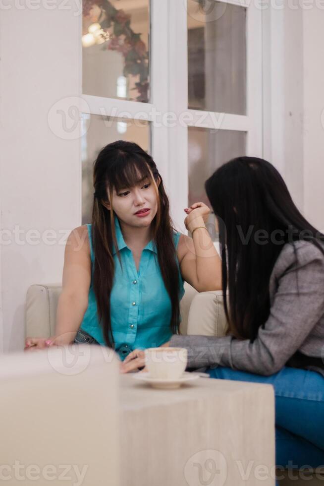 Heart-to-heart, Friends sharing conversation over coffee at a br photo