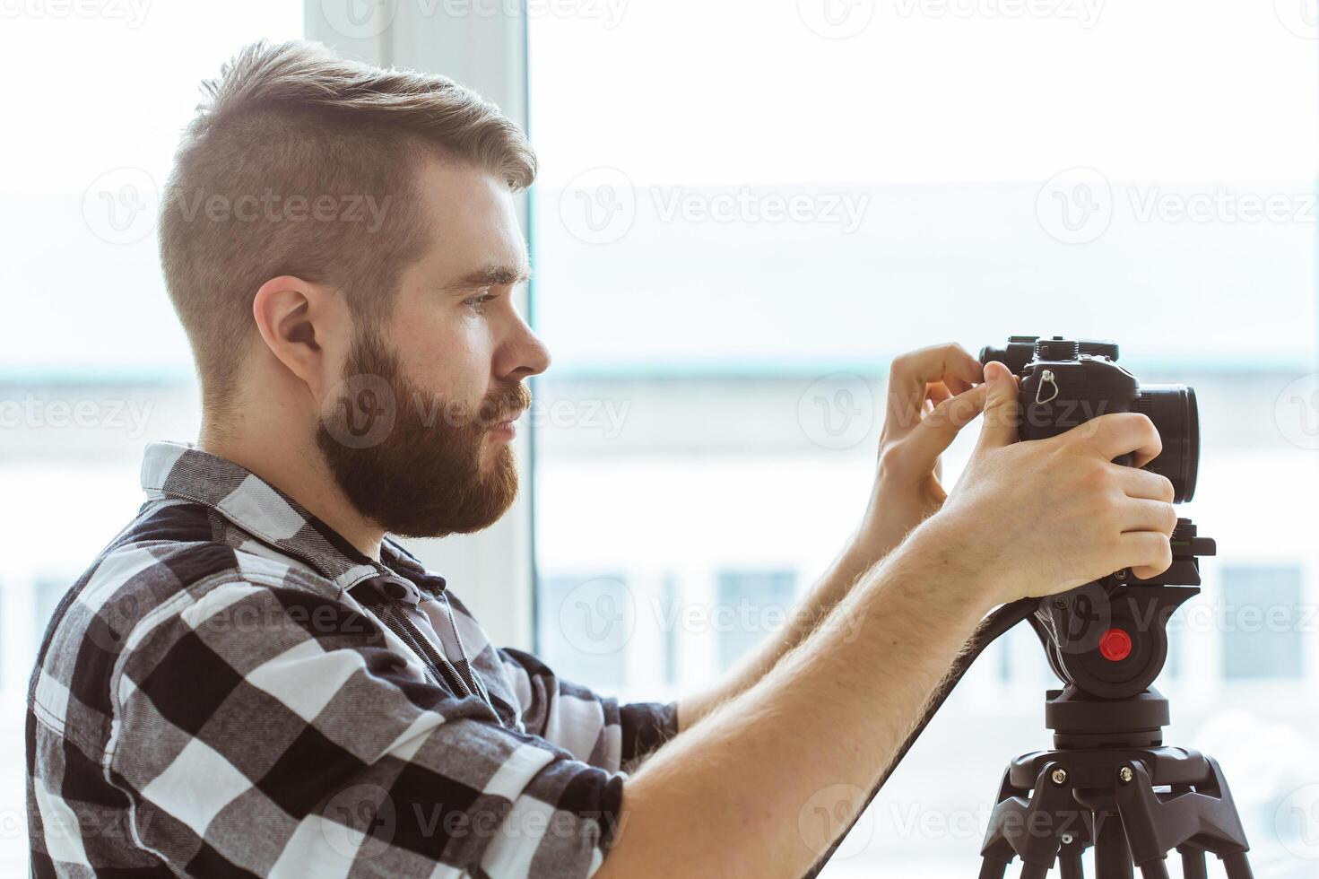 production, shooting advertising and content for social networks - Operator working with a camera. photo