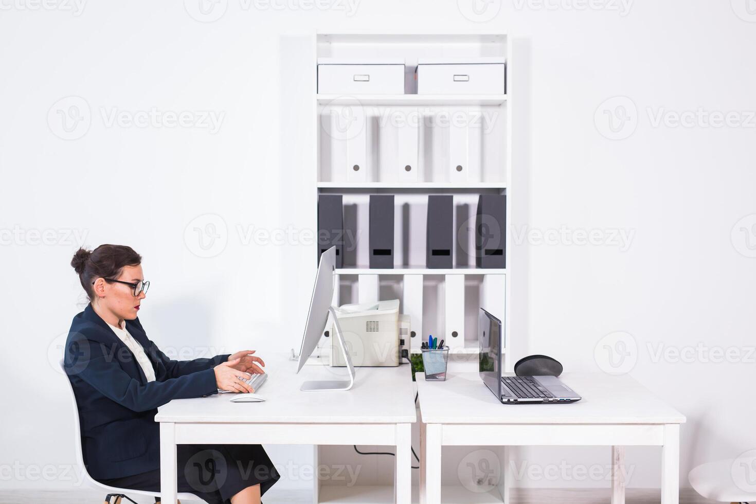 Busy female office worker. Business people and technologies concept. photo