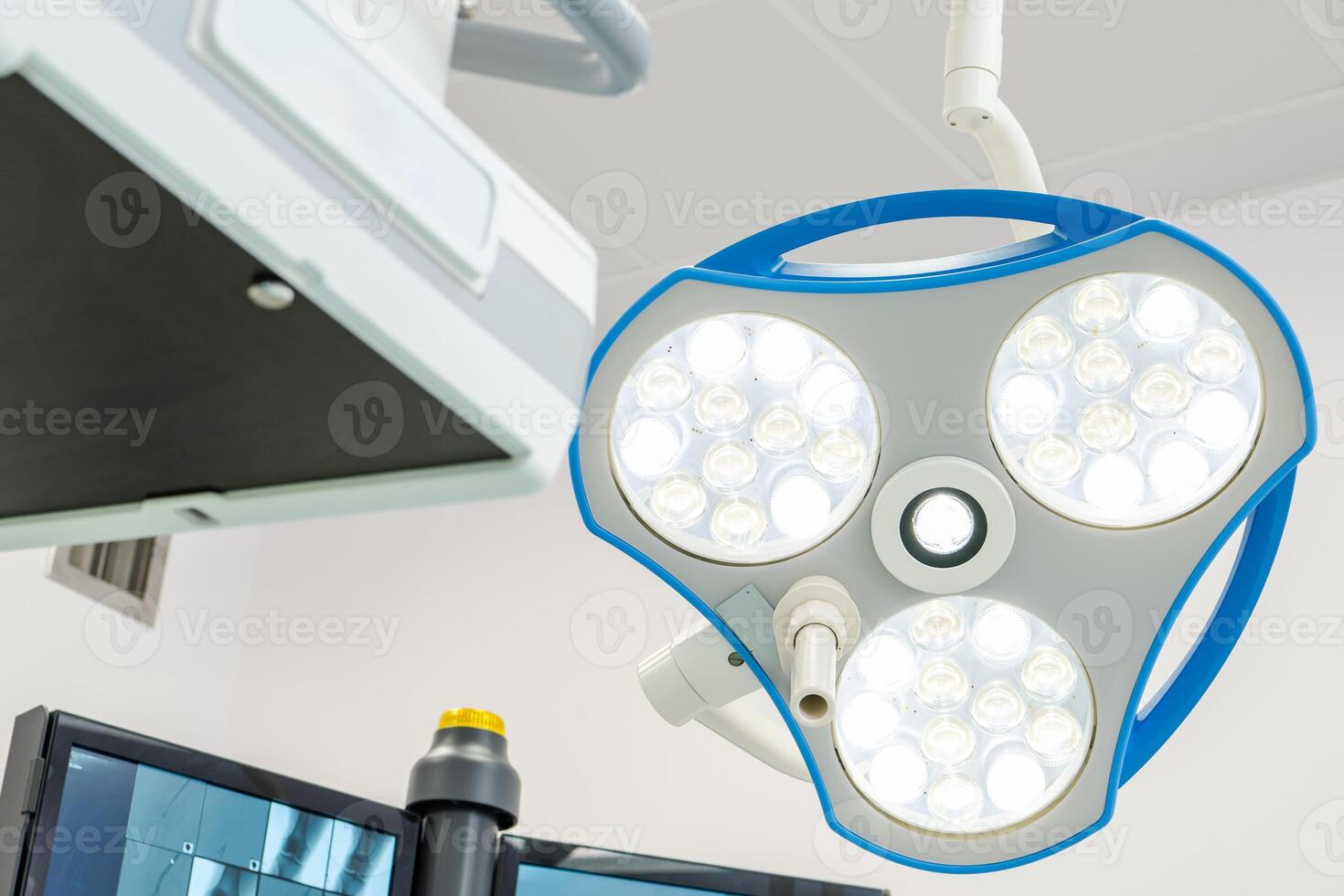 Bright Surgical Light Illuminating a Modern Operating Room During a Crucial Medical Procedure photo