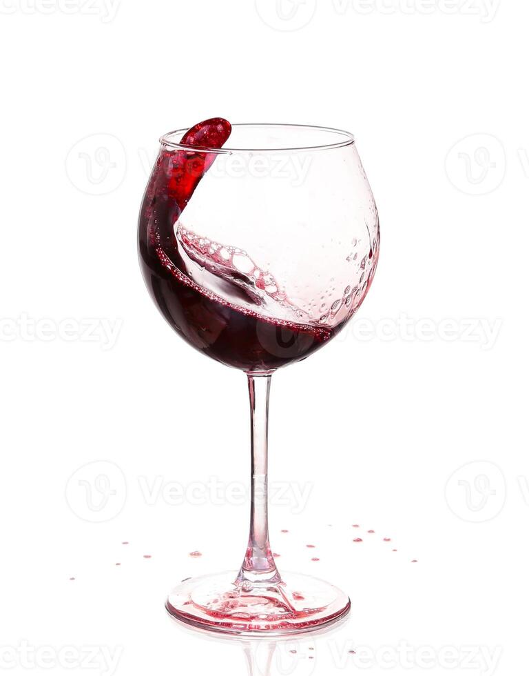 A red wine glass with a splash of liquid photo