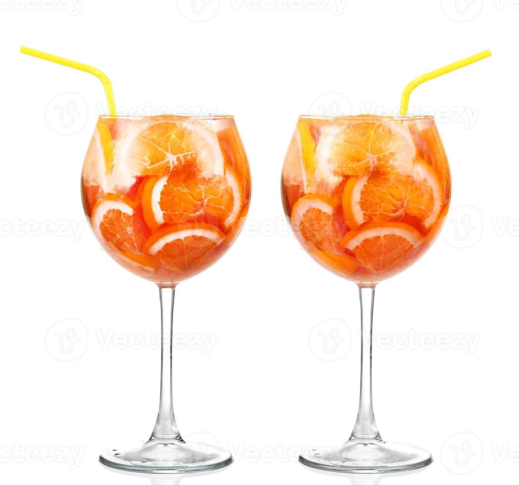Two glasses of orange juice with straws photo