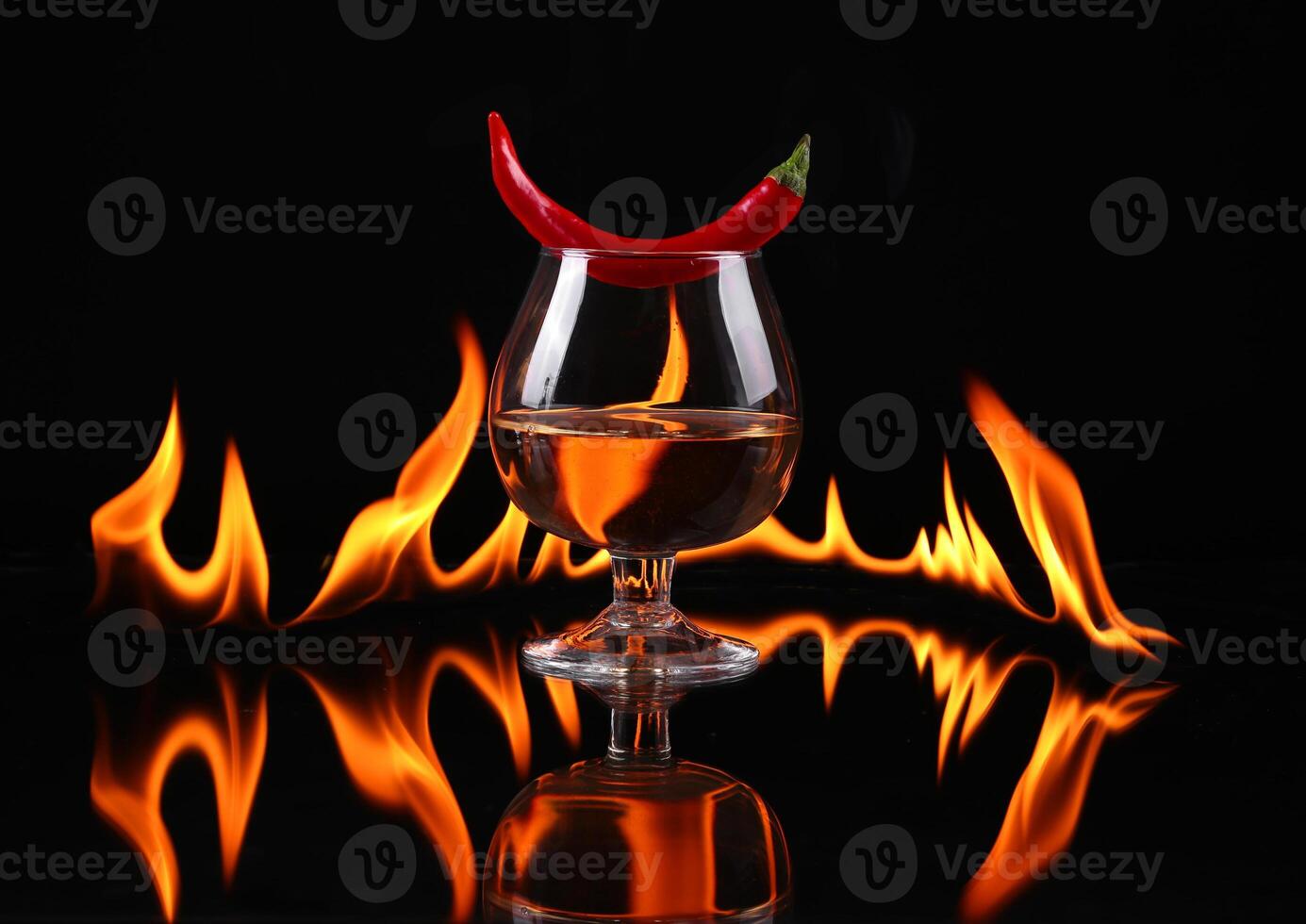 A glass of wine with a chili pepper on it photo