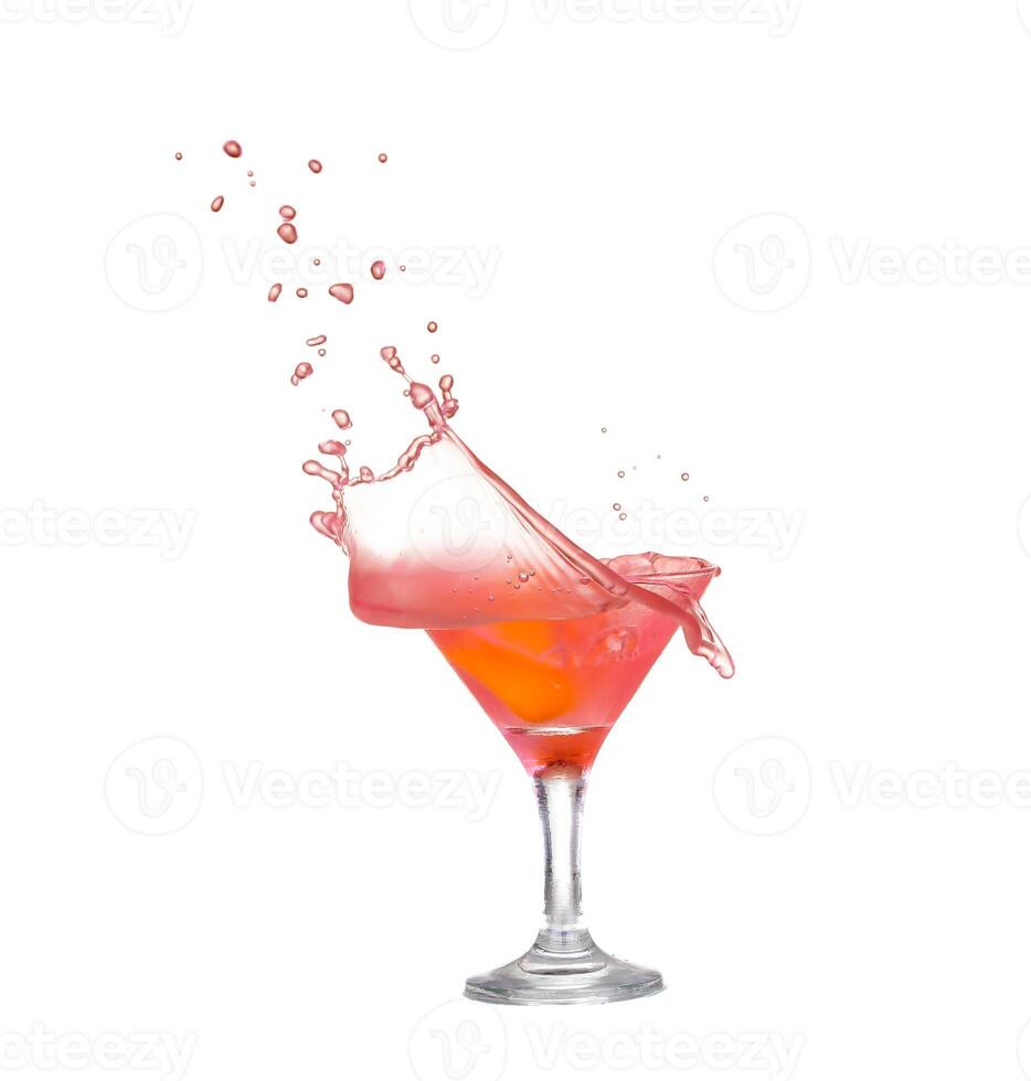 A red cocktail with a splash of water photo