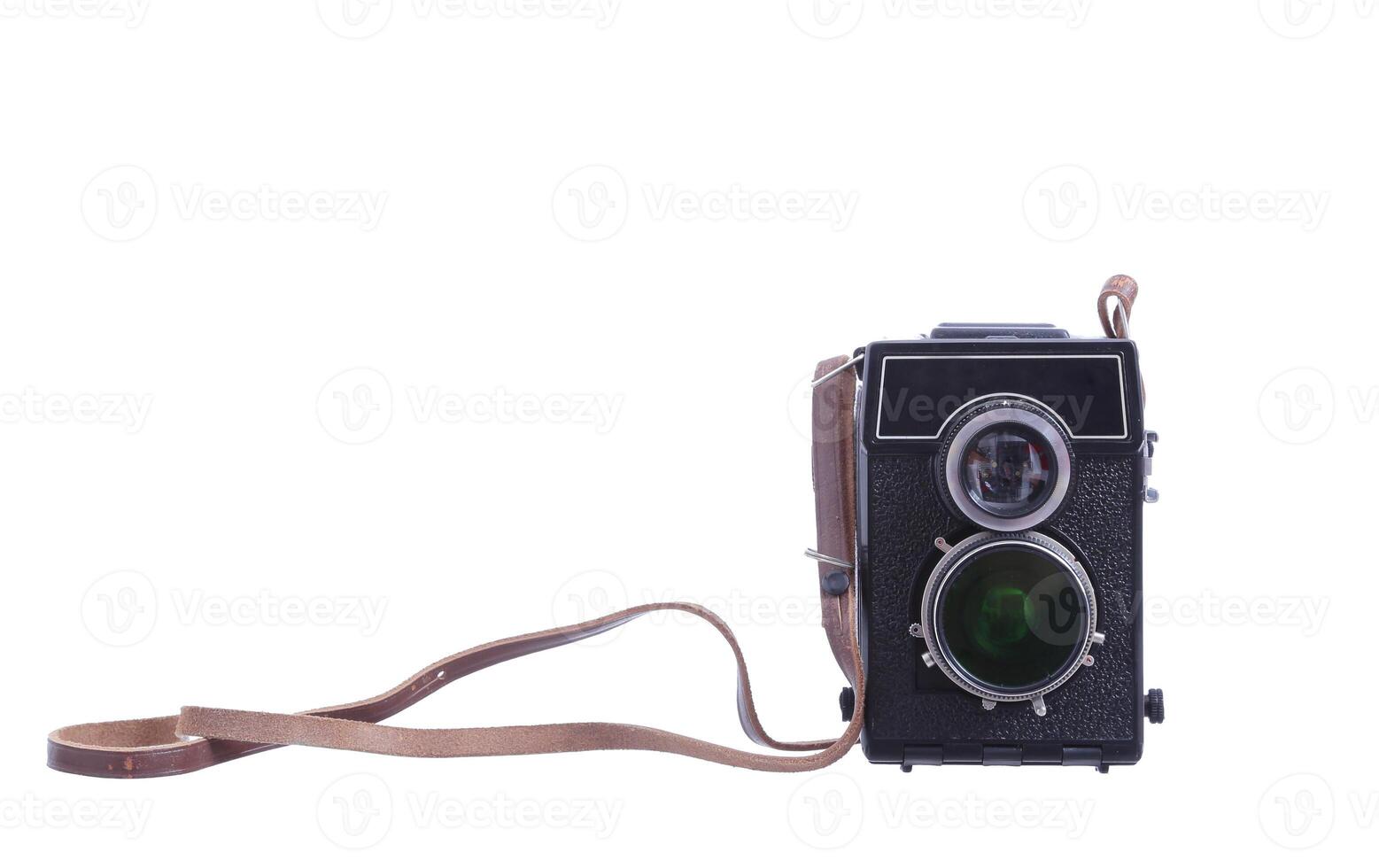 An old camera with a strap and a lens photo
