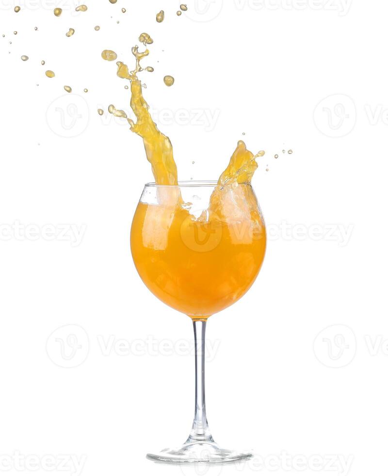 Orange juice splash in a glass photo