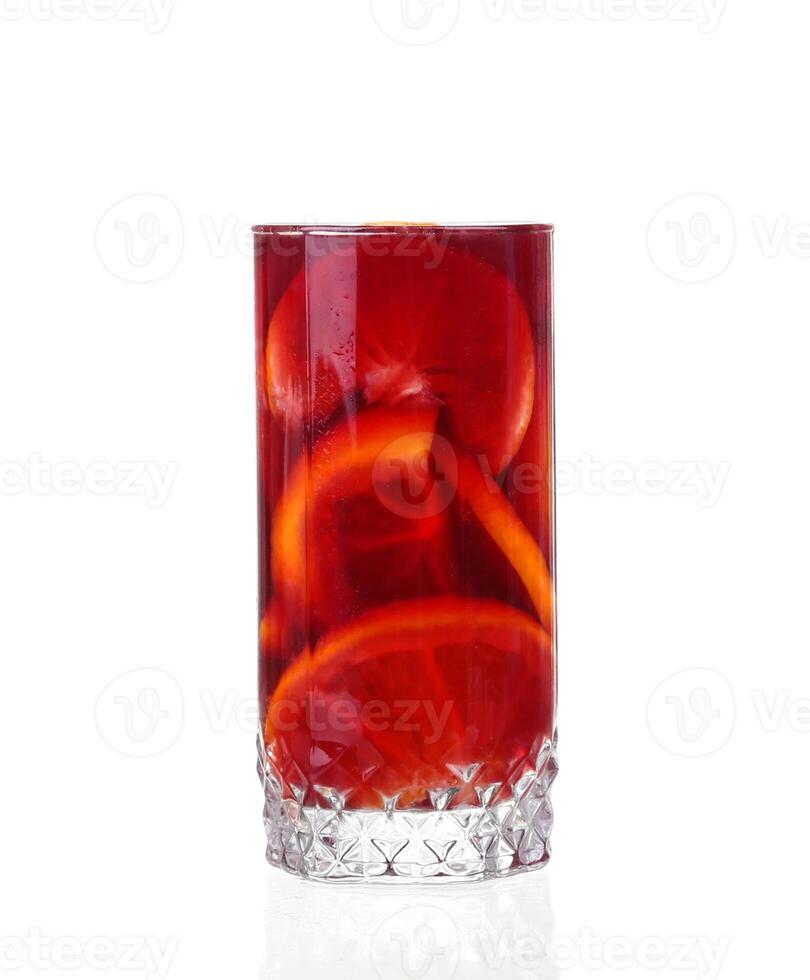 A glass of red wine with slices of orange photo