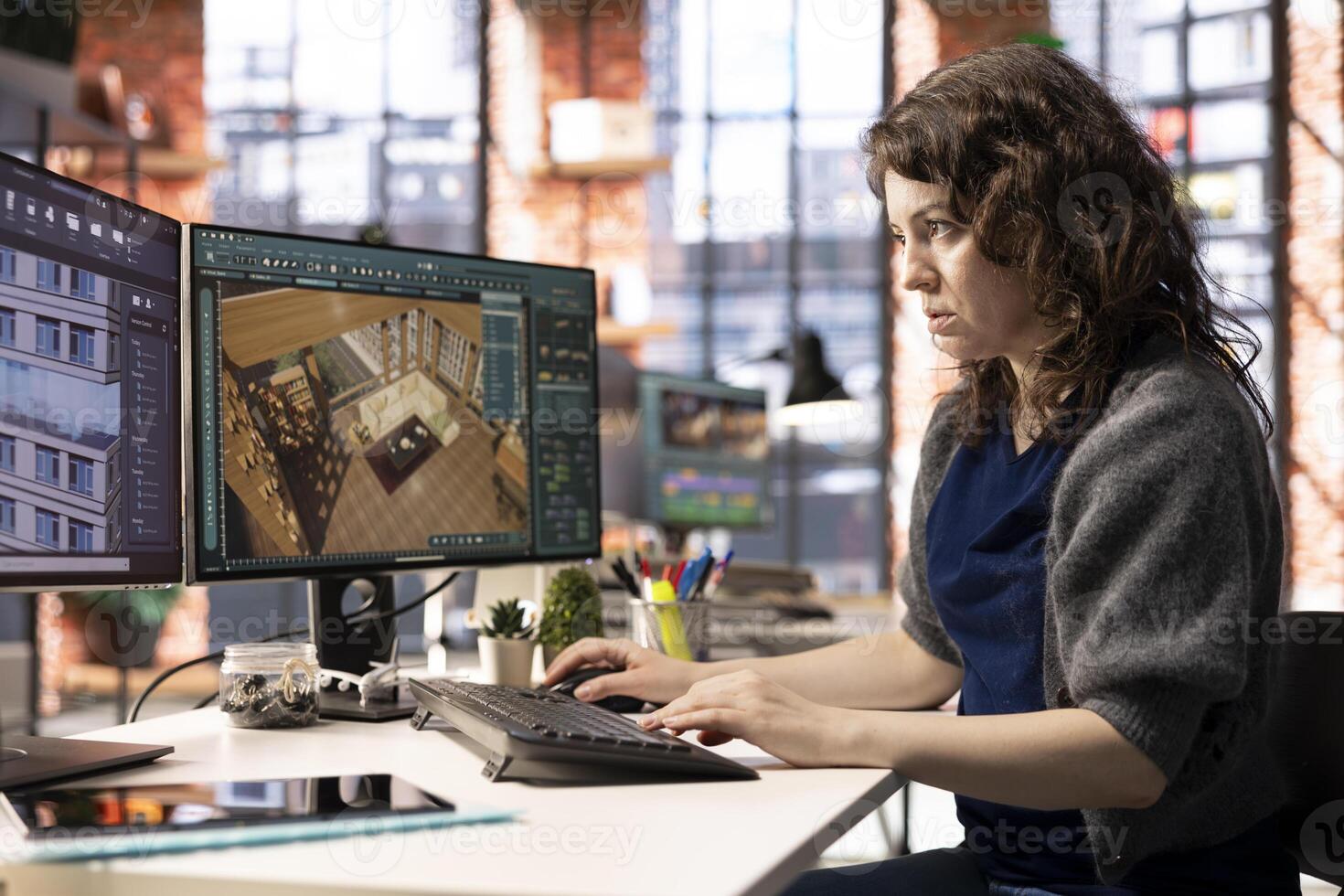 Architectural designer works on digital home design project, using a 3D modeling program to arrange furniture. The software with advanced user interface for professional rendering. photo