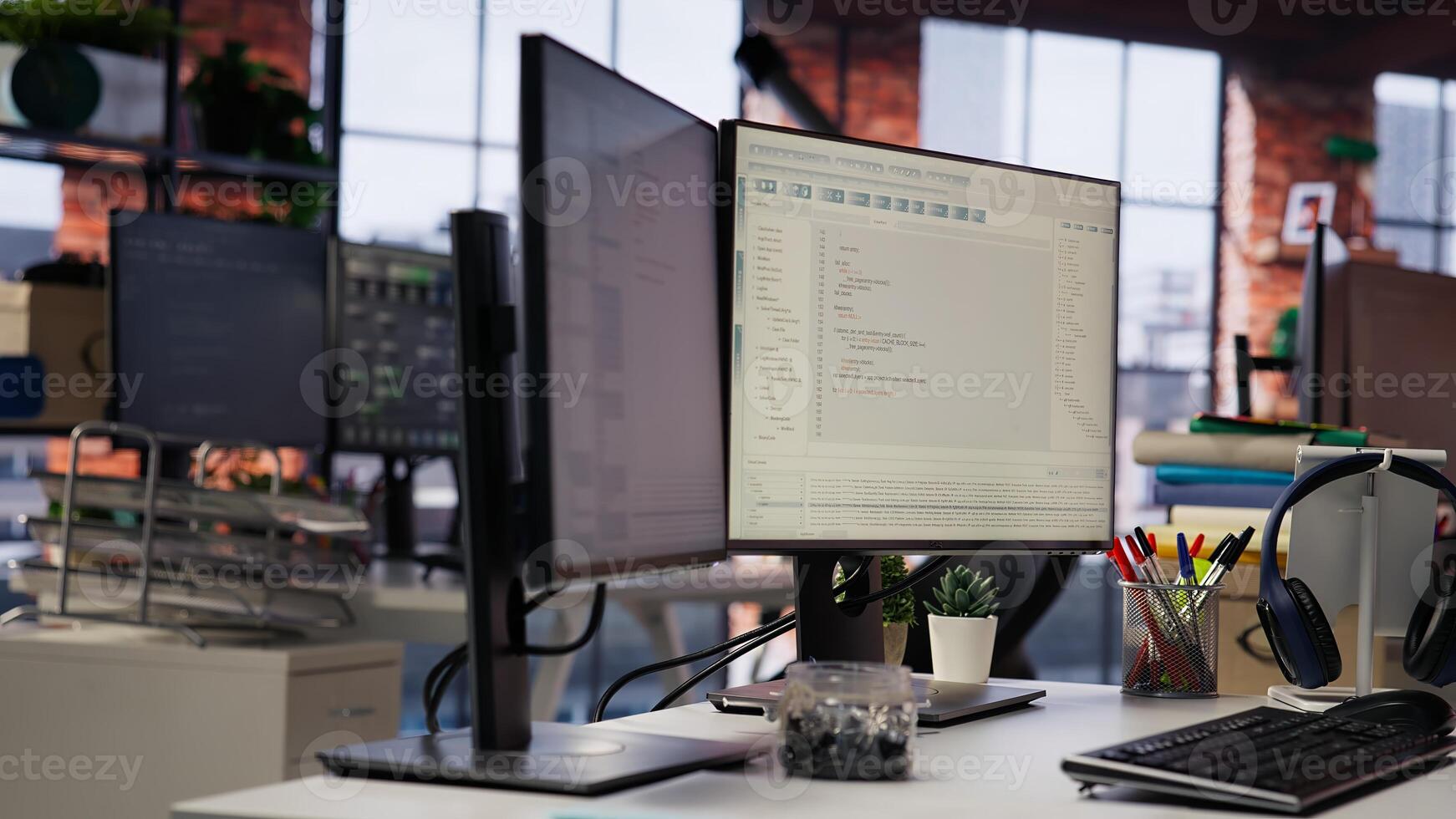 Advanced AI algorithms running on computer monitors in startup workspace deploying machine learning models. Coding platform on PC screens in Silicon Valley office, close up shot photo