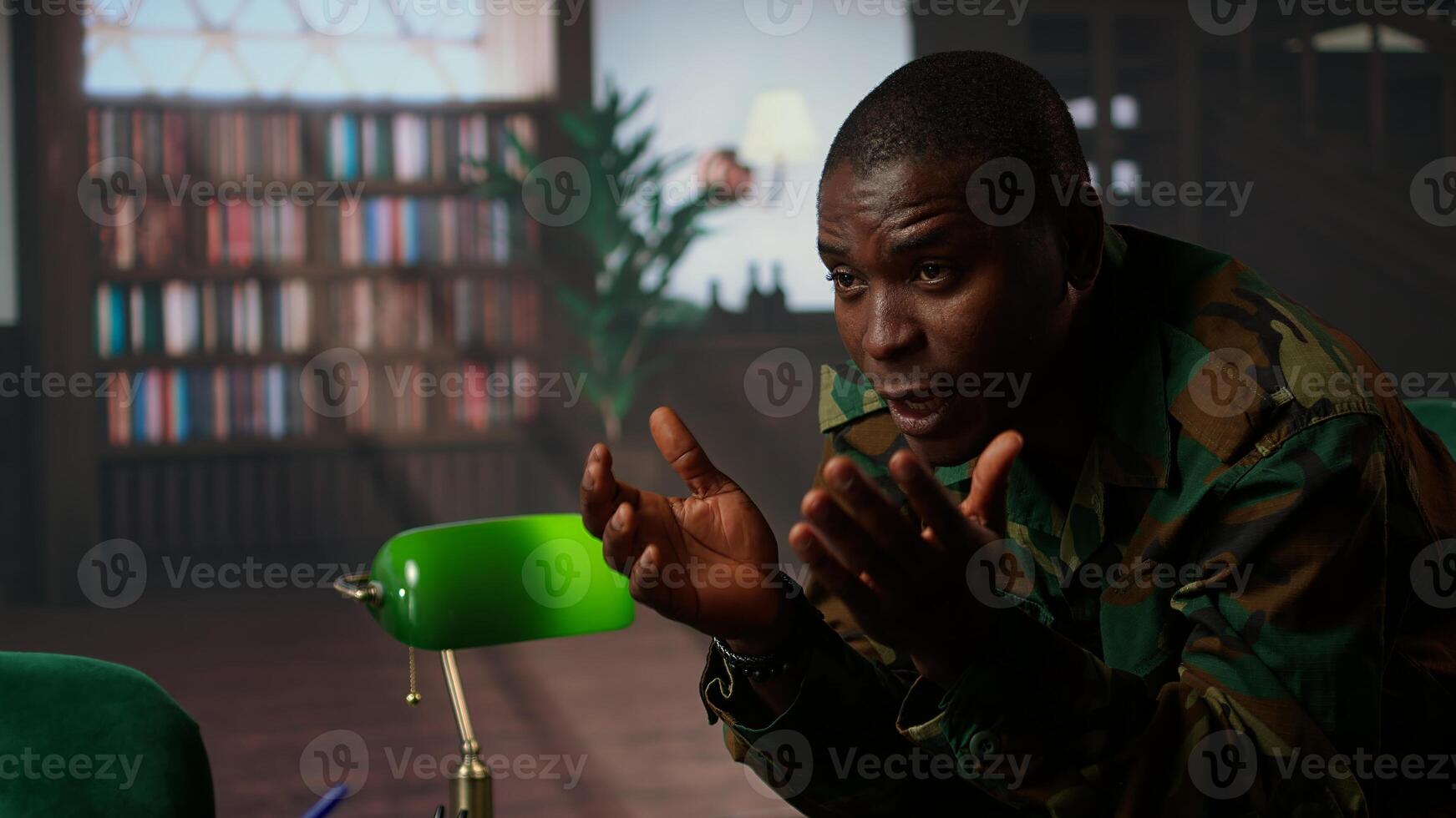 Therapist helping army soldier during psychotherapy session, suffering from bipolar disorder and shell shock due to war flashbacks. Distraught military personnel deals with PTSD. Camera A. photo