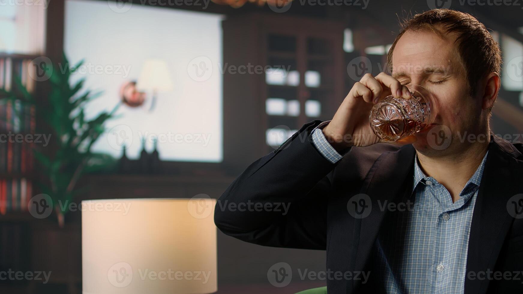 High society member enjoying glass of whiskey bourbon in private social club, emphasizing the sophisticated upper class lifestyle and entertainment. Old money luxury. Camera A. photo
