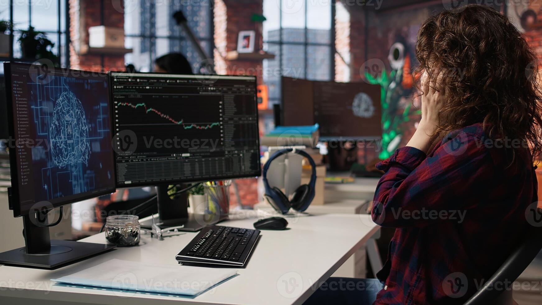 Manager delighted by successful IPO, watching live market updates showing stocks raising. Venture team leader happy after becoming publicly traded company, giving good news to team, camera A photo