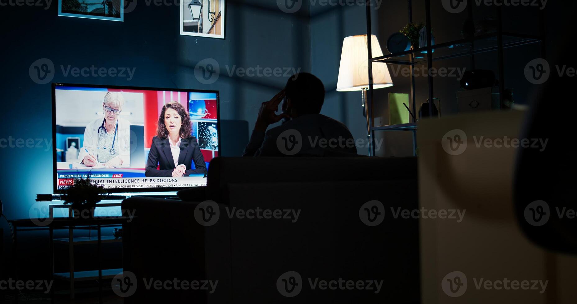 Curious spectator reading news coverage titles on smart tv, sitting on couch and listening to journalist lay out recent global events. Guy watching daily news headlines. Camera A. photo