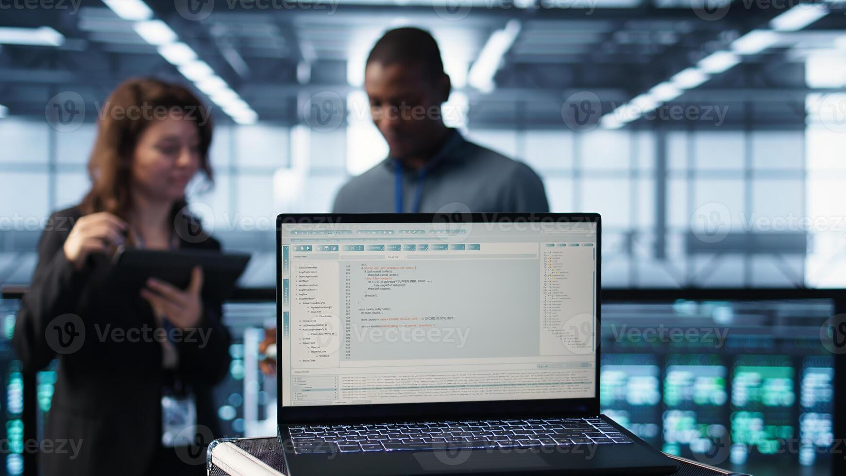 Lines of code on laptop display used by data center colleagues to run security patches. Programming language on notebook used by IT experts scanning gear, camera B close up photo
