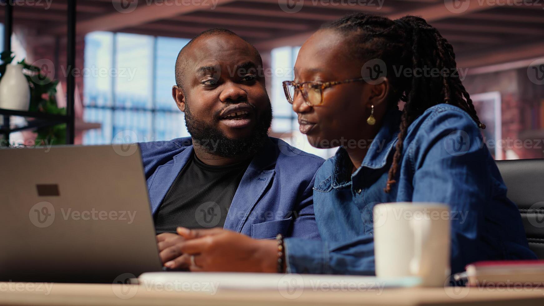 Tech savvy people working on laptop to test new software, navigating digital tools and managing virtual tasks. Connected and productive lifestyle at home. Camera B. photo