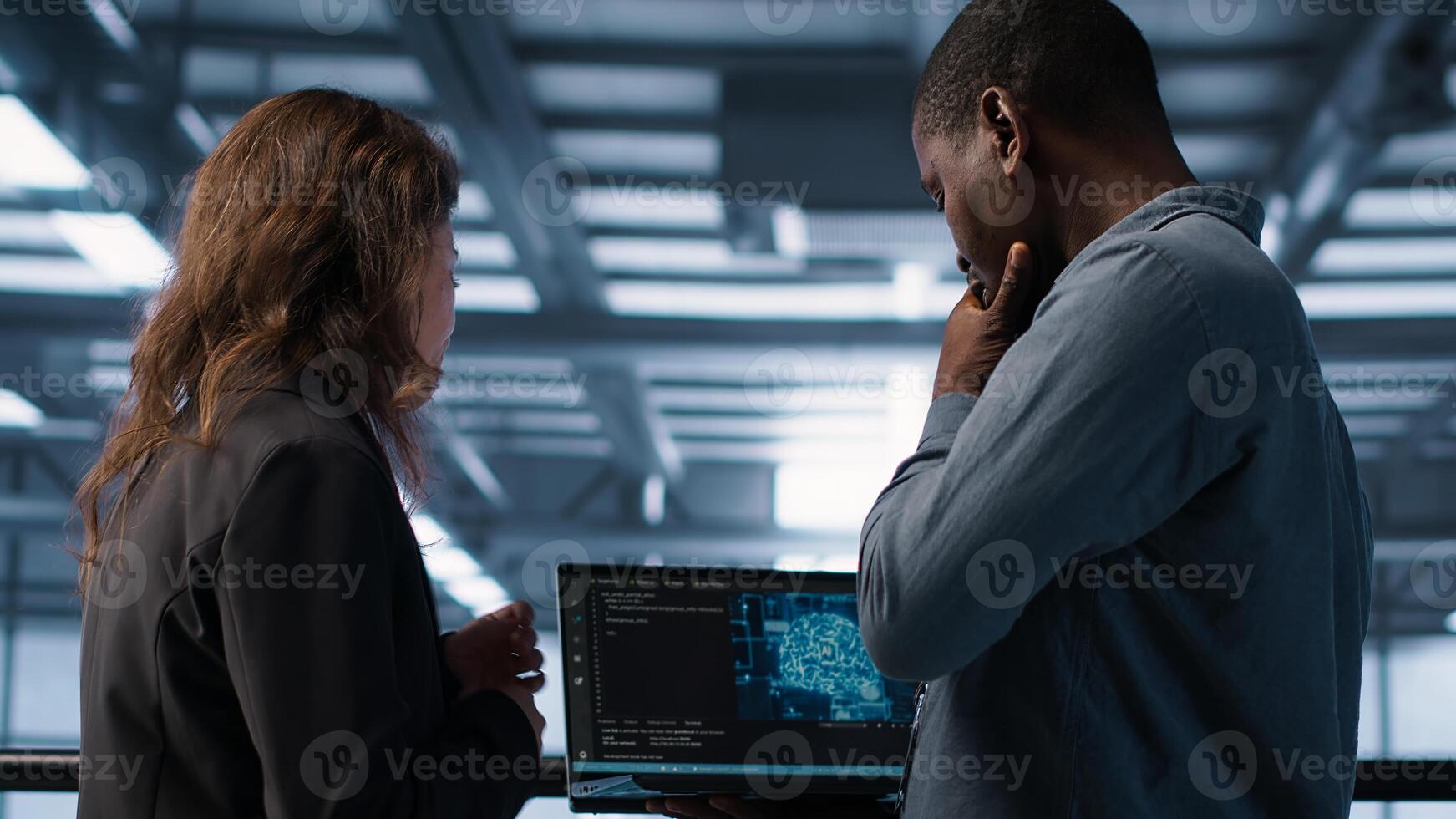 Software developers using laptop, employing AI machine learning models. Workers using notebook to fulfill artificial intelligence infrastructure needs, allocating resources, camera A photo
