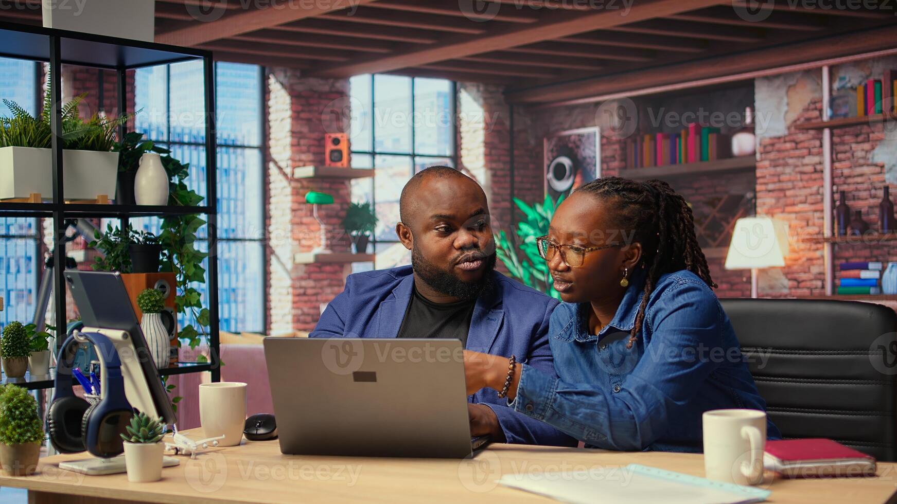 Tech savvy people working on laptop to test new software, navigating digital tools and managing virtual tasks. Connected and productive lifestyle at home. Camera A. photo