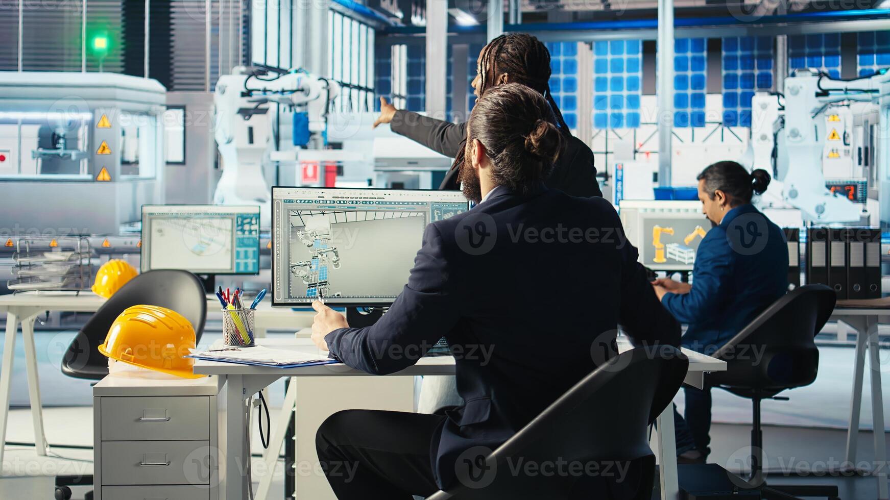 Photovoltaics factory manager working with engineering team, improving systems reliability. Sustainable energy solar panel manufacturing plant expert providing feedback to workers photo