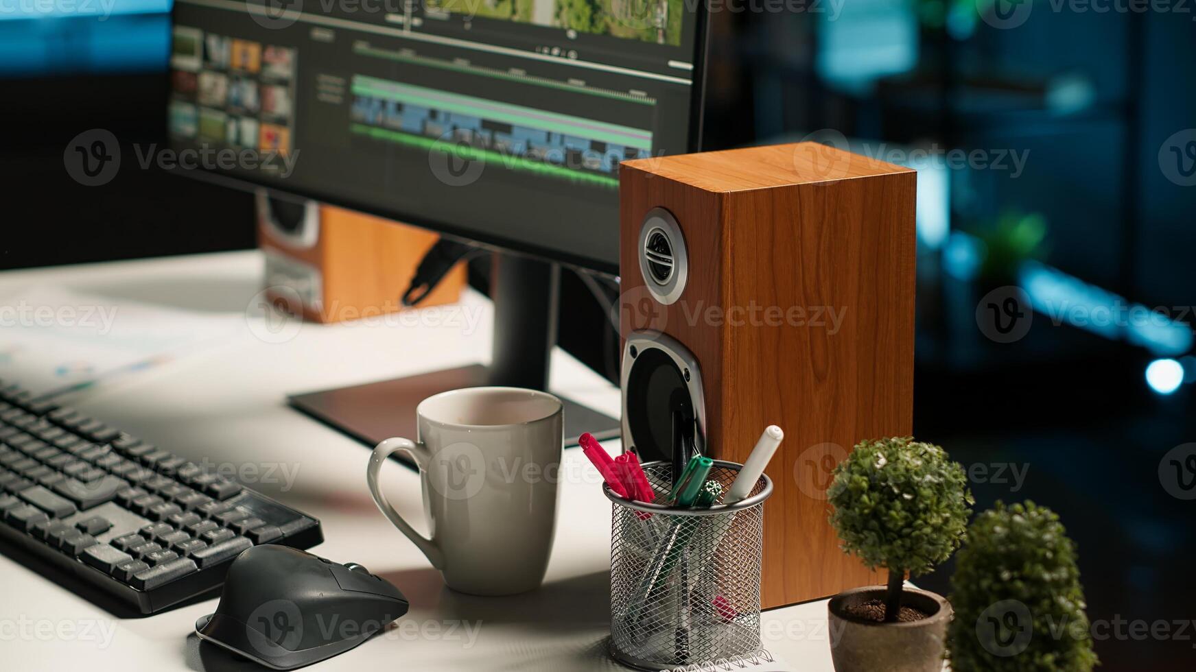 Young man working on editing movie montage project, multitasking with dual monitors. Male footage editor starting cinematic creative process, film editing industry. Camera B. photo