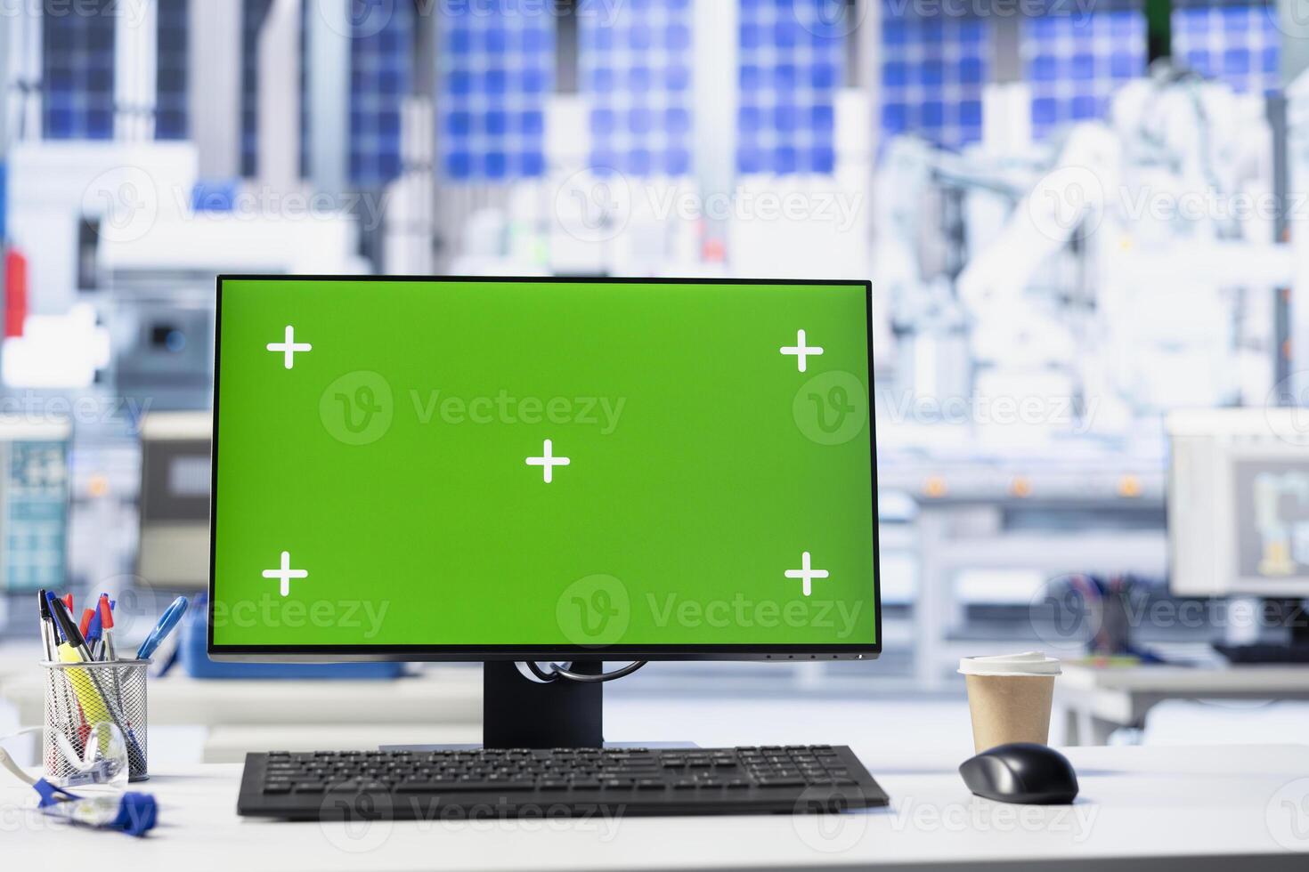Isolated screen PC in factory used to monitor performance of robot arms manufacturing solar panels. Chroma key mockup computer in empty facility used to inspect photovoltaics machinery photo