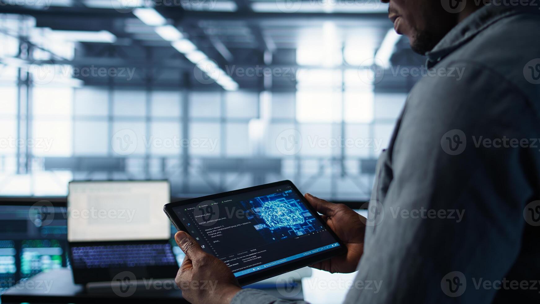 Close up of computer scientist in data center uses AI on tablet, verifying compliance of racks. IT expert using artificial intelligence to optimize resource utilization, camera B photo