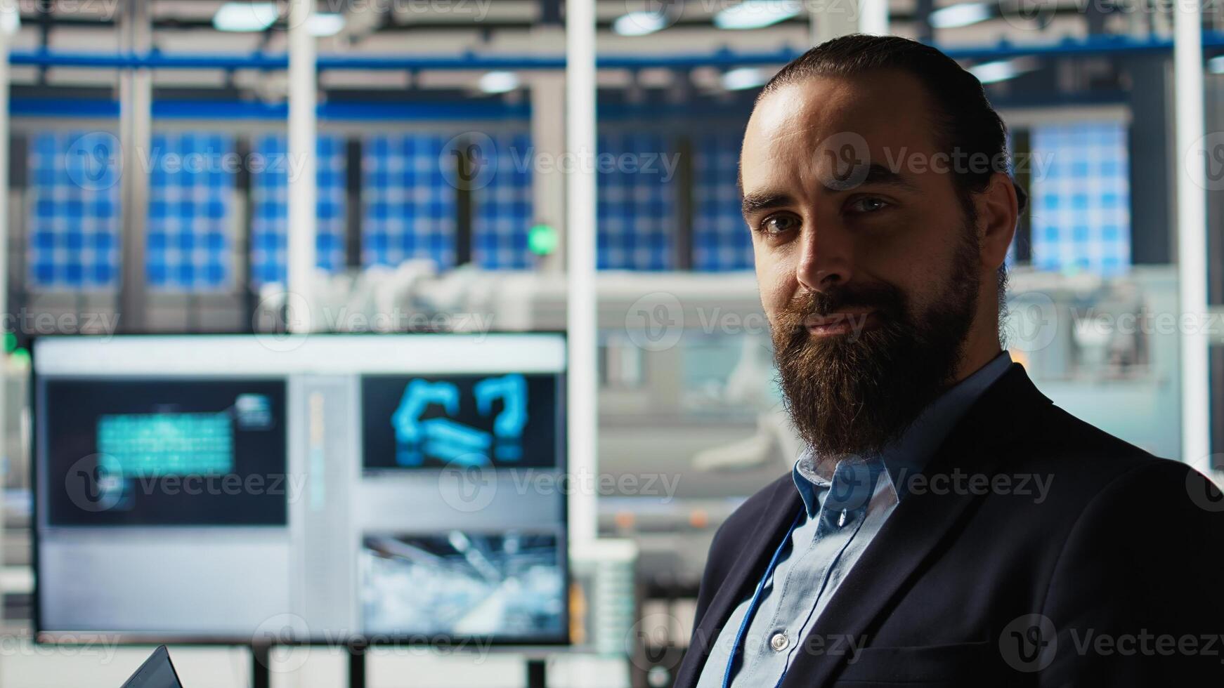 Portrait of man using laptop to improve efficiency in solar panels plant. Photovoltaics factory research expert using notebook, working on green energy solutions, camera A photo