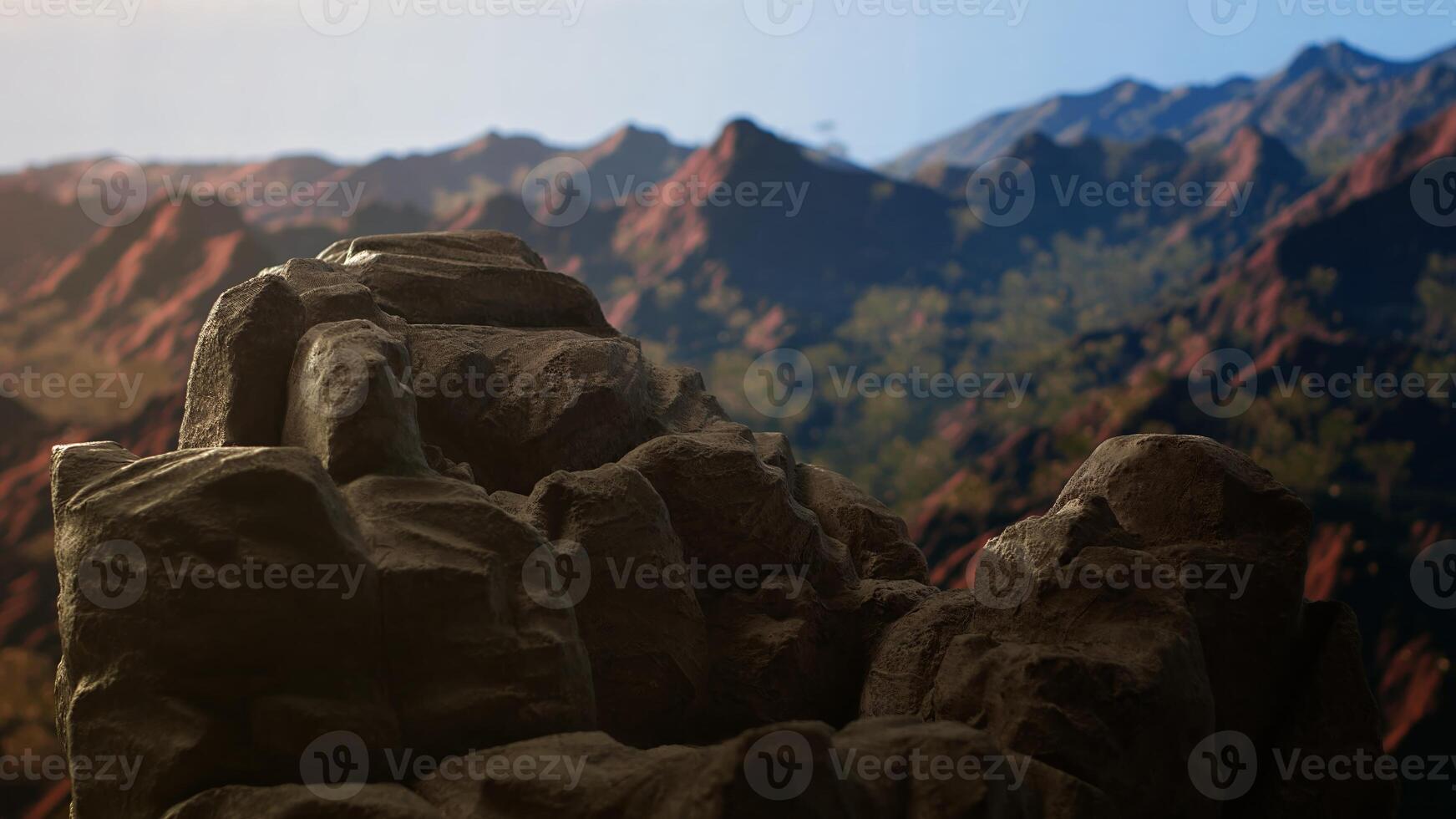Panoramic view of stunning mountain range with rocky terrain in foreground. Perfect for adventure seekers looking for extreme hiking experience in heart of untouched wilderness. photo