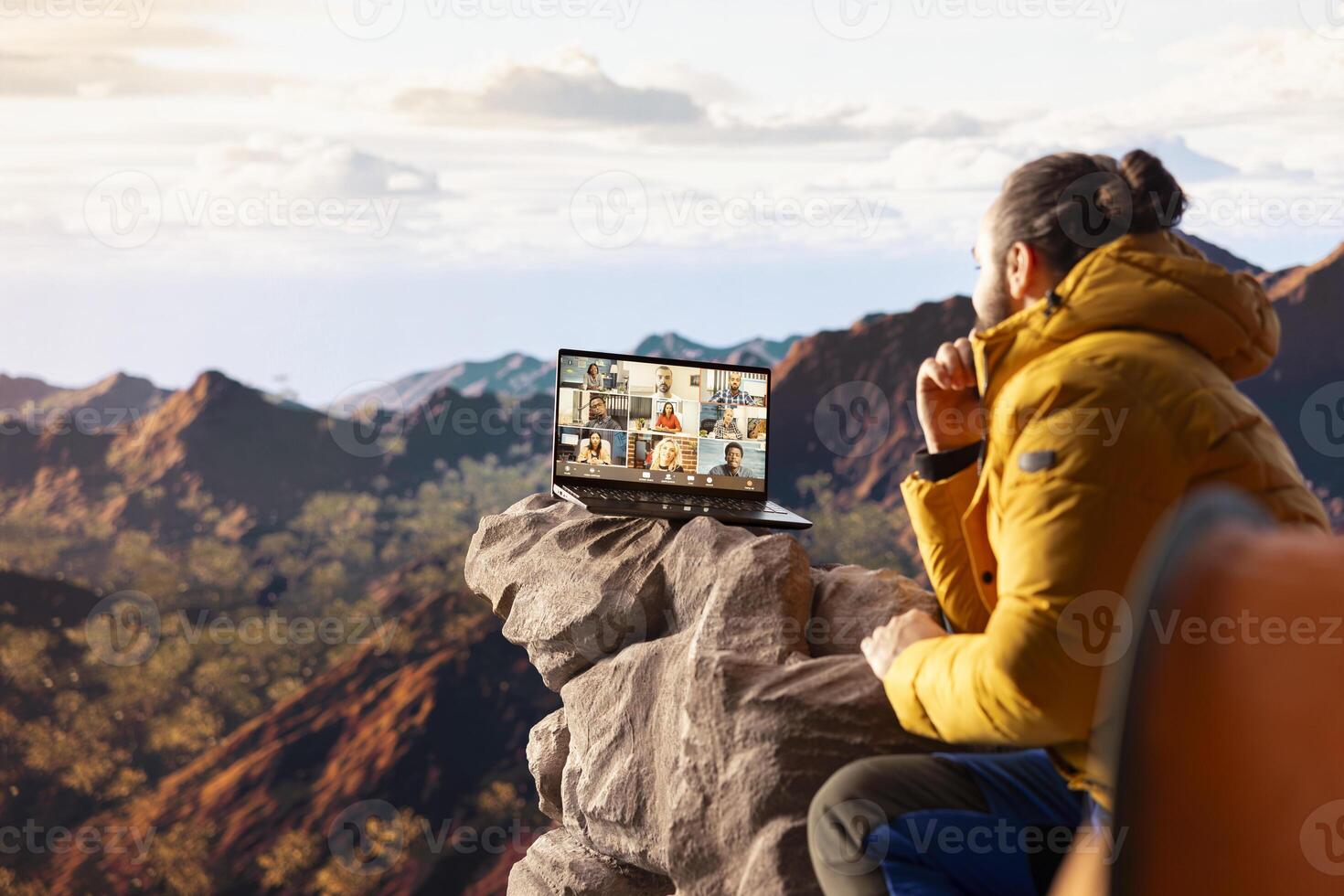 Business employee uses high speed connection on mountain, enjoying call with scenic landscape. Male hiker with internet dependency being workaholic. photo