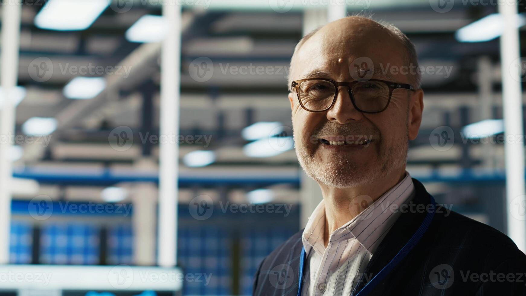 Smiling senior engineer in solar panels plant reading documentation to improve efficiency. Elderly man checking paperwork in photovoltaics factory research and development department, camera B photo