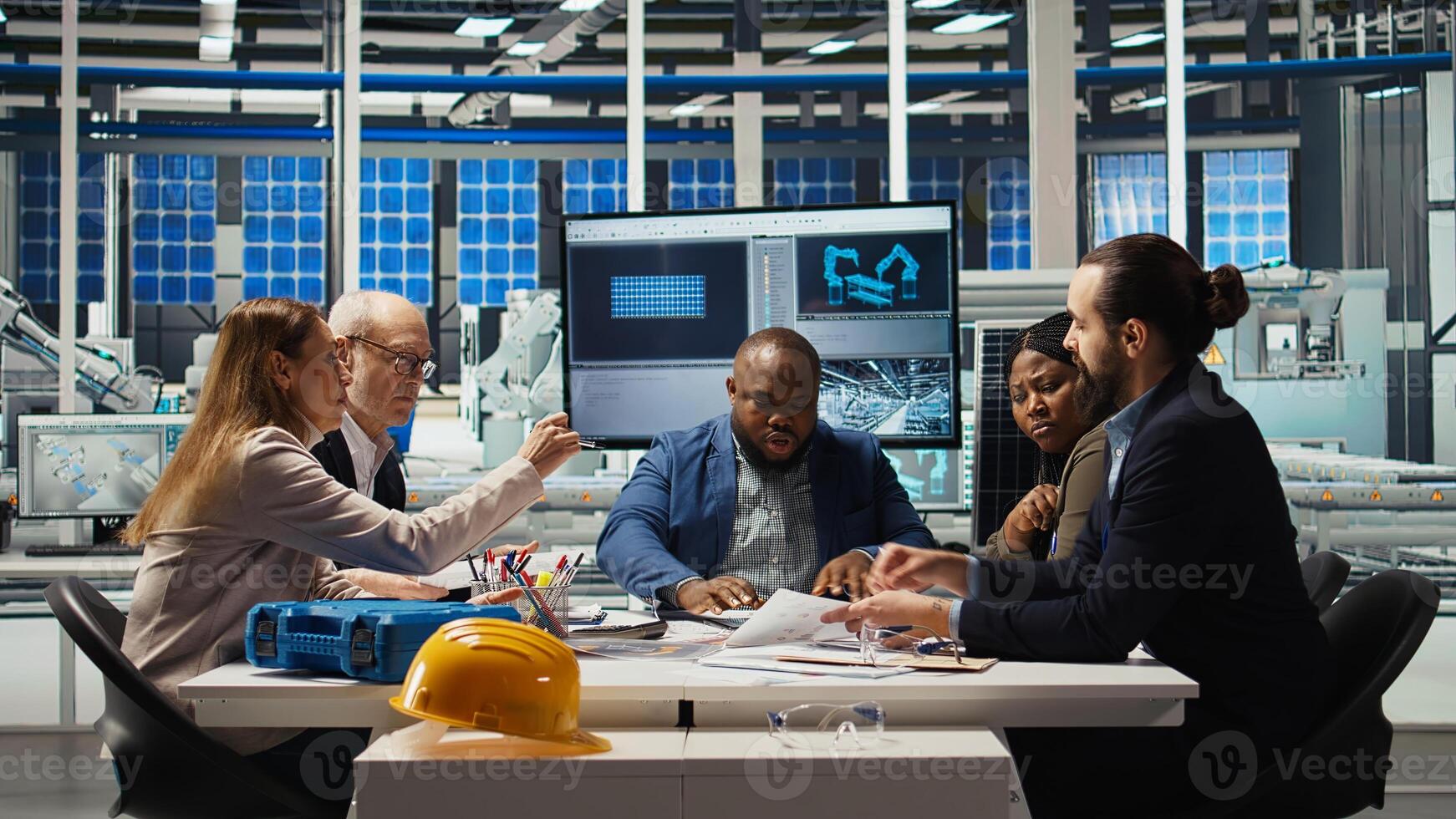 Manager presents business models to investors, highlighting innovative strategies for expanding production. Shareholders discuss integrating automation technology in industrial plant, camera A photo