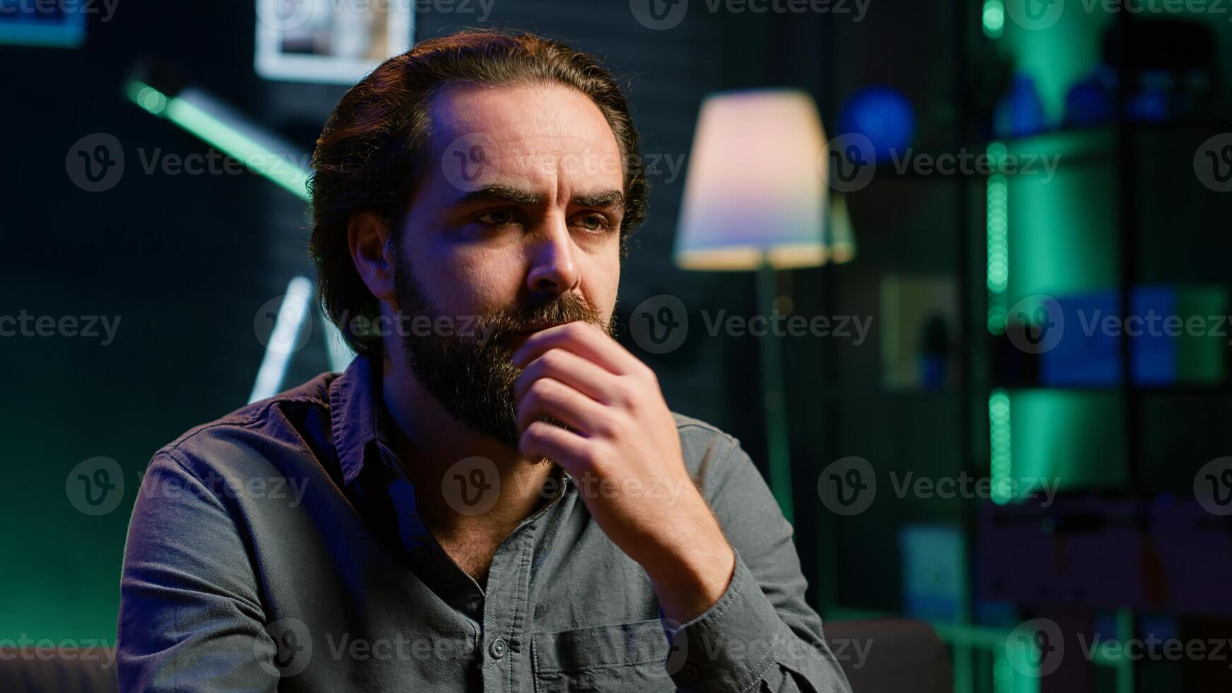 Perplexed supporter watching sports match on TV, surprised by team performance. Man looking at football competition, baffled by easy chance missed by player, camera A closeup photo