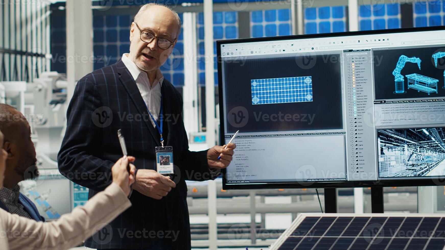 Management executives and investors in photovoltaics plant analyzing market trends to determine strategies for expanding solar energy production capabilities, camera B photo