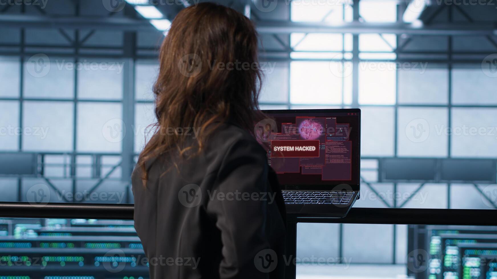 Panicked woman seeing data center getting attacked by hackers trying to steal data. Technician in server farm seeing errors on laptop screen, struggling to contain virus infestation, camera A photo