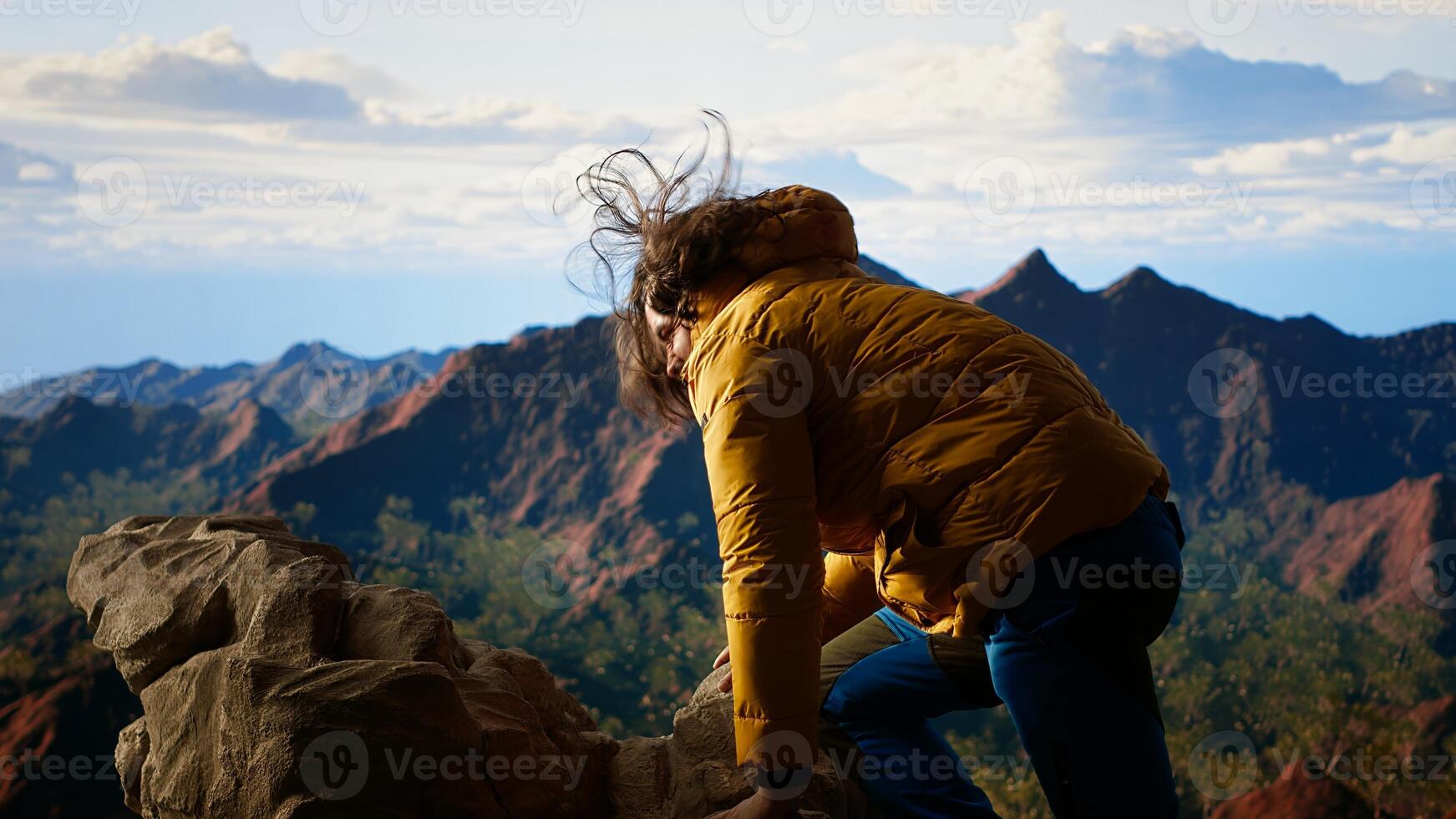 Clumsy hiker tripping and falling off of mountain peak, leading to accident due to lack of attention. Inconsiderate unprepared traveler stumbles on unstable terrain. Camera B. photo