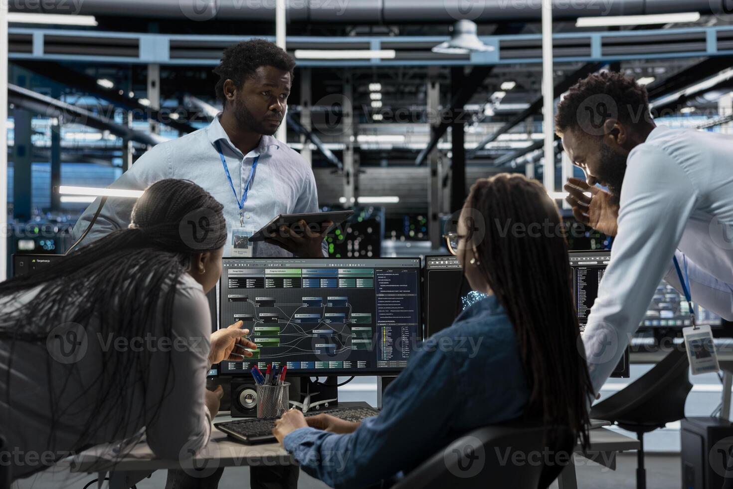 System administrators programming in AI data center housing advanced equipment used for machine learning training. Server hub employees run code on PC to upgrade artificial intelligence systems photo