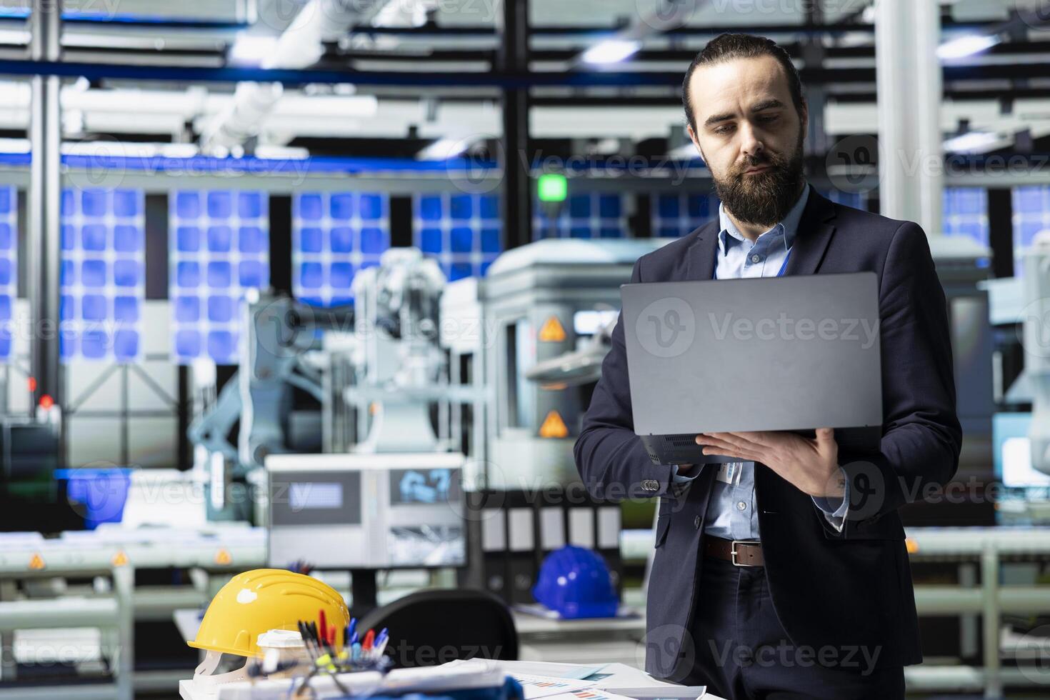 Executive consultant oversees solar energy systems in industrial workplace, emphasizing strategic planning for sustainable energy development. Innovation in clean power production line. photo
