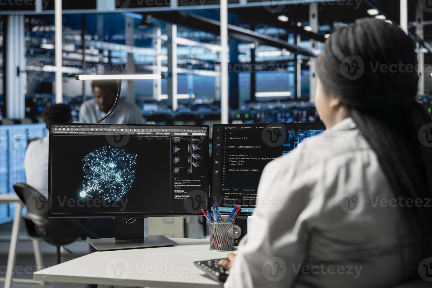 Data center computer scientist at work using machine learning algorithms to analyze datasets. Server room staff member using artificial intelligence to recognize data patterns photo