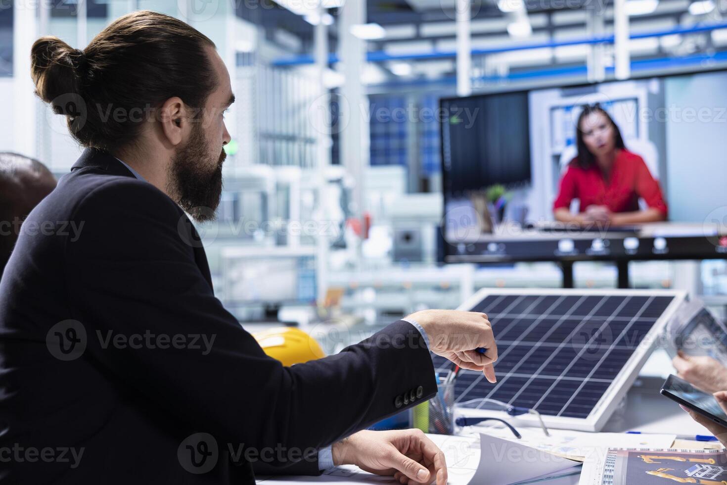 Photovoltaics factory team in teleconference meeting improving development efficiency. Solar panels plant researchers in office studying how to harness sun power during online videocall photo