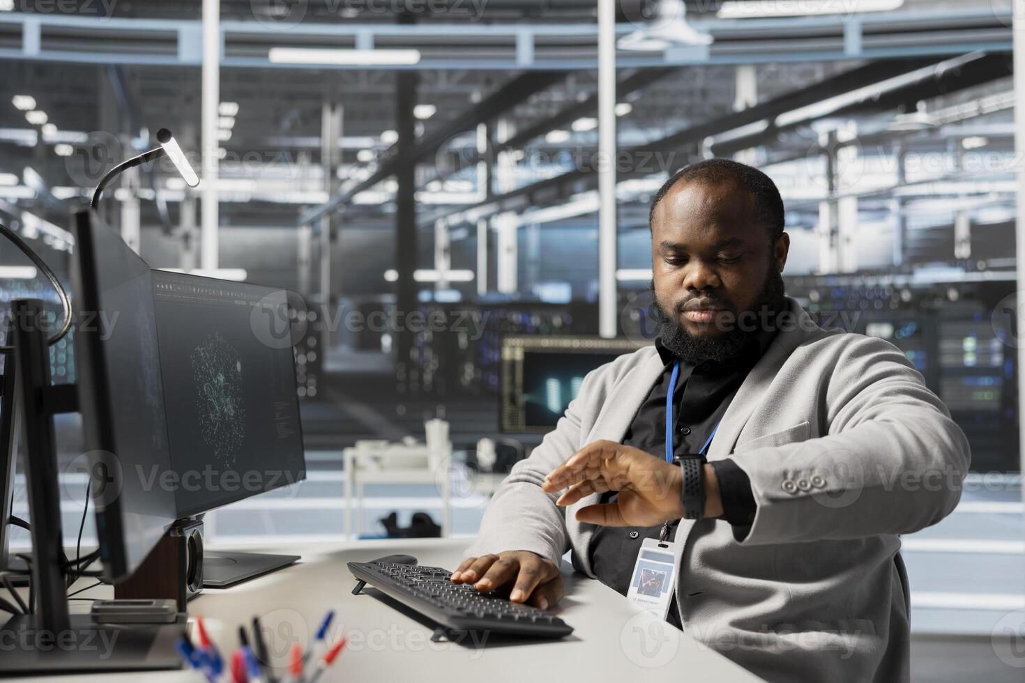 Data center engineer checking clock at work, waiting for job shift to end while verifying neural network parameters. Stressed server hub worker checking watch, pressured by deadline photo