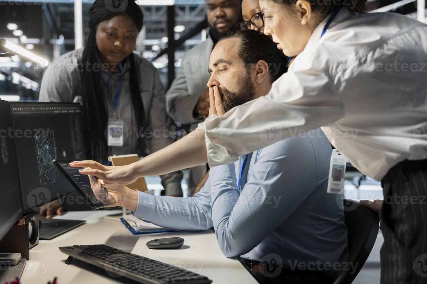 Team of admins working together in server hub, analyzing rigs data. Data center office IT professionals doing brainstorming, examining supercomputers gear, ensuring system integrity and security photo