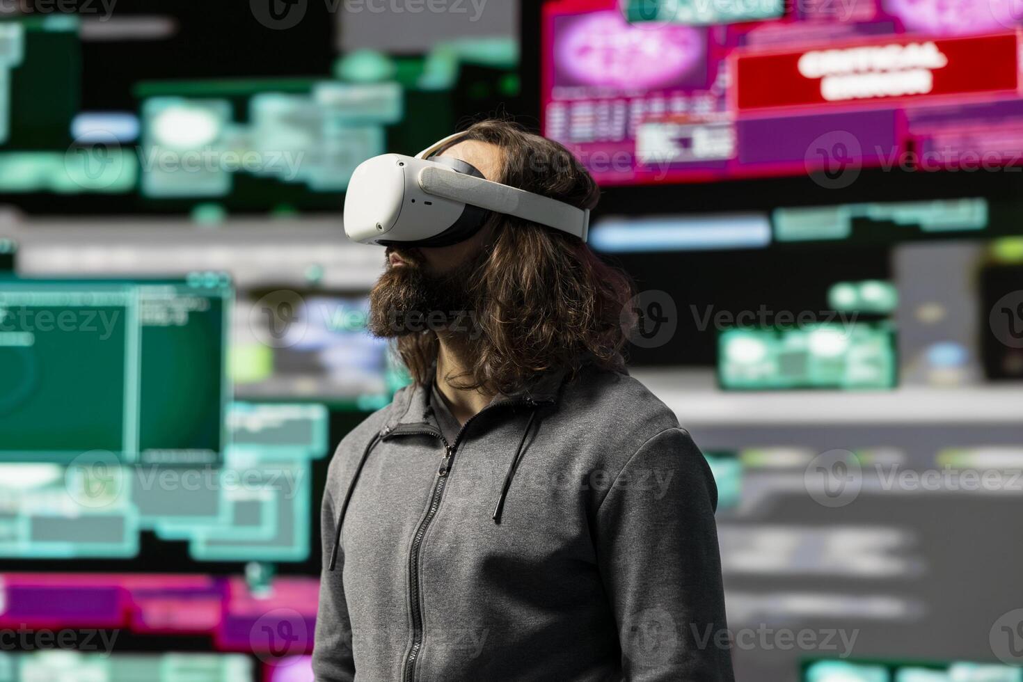 Hacker uses virtual reality glasses for system infiltration and penetration, cyber intelligence define this tech driven information theft. Intrusion and threat alerts reveal dangerous hacking. photo