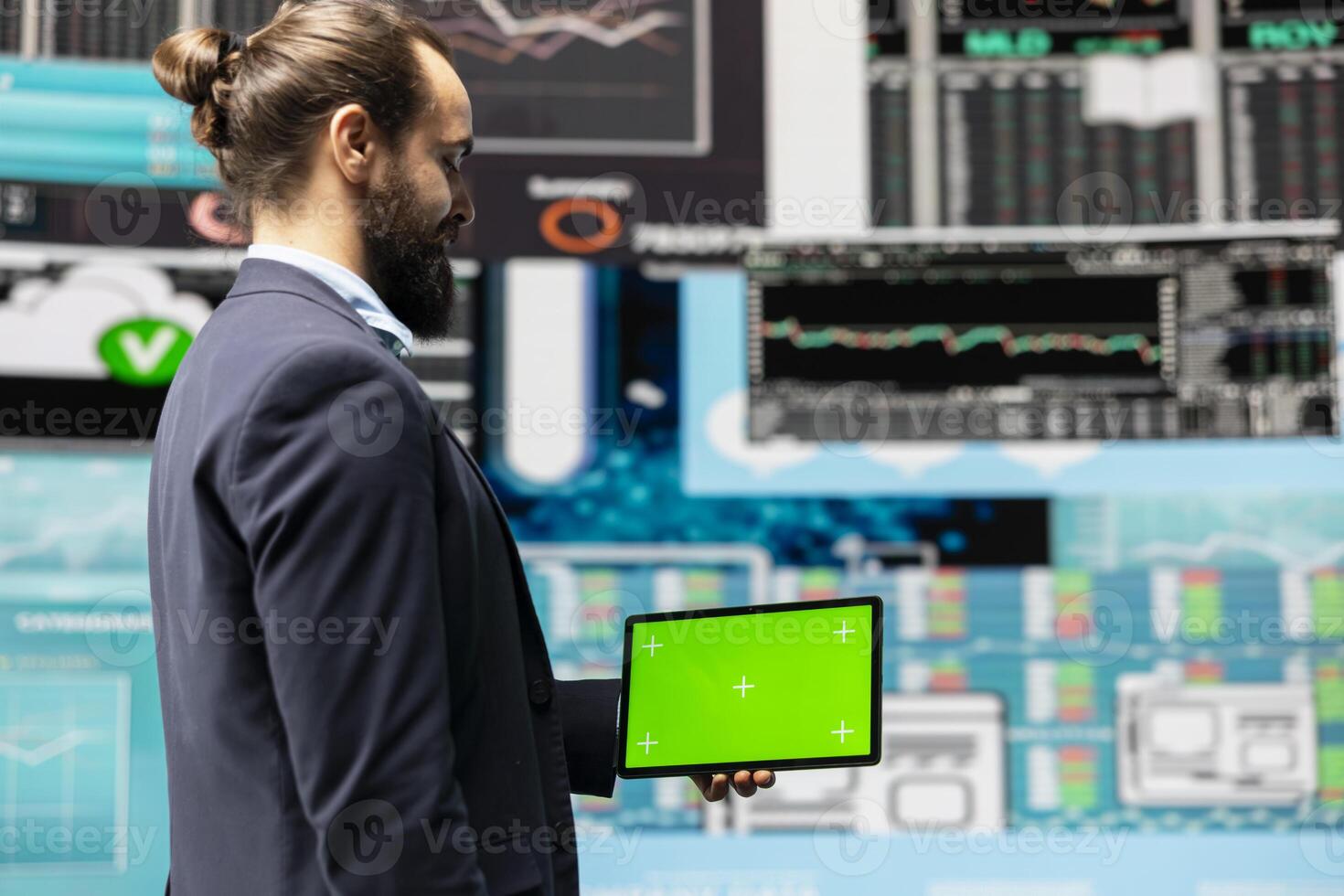 Male expert uses tablet with chroma key display leveraging dashboards, financial trends and KPI metrics optimizing company performance and planning for future success. Leadership. photo